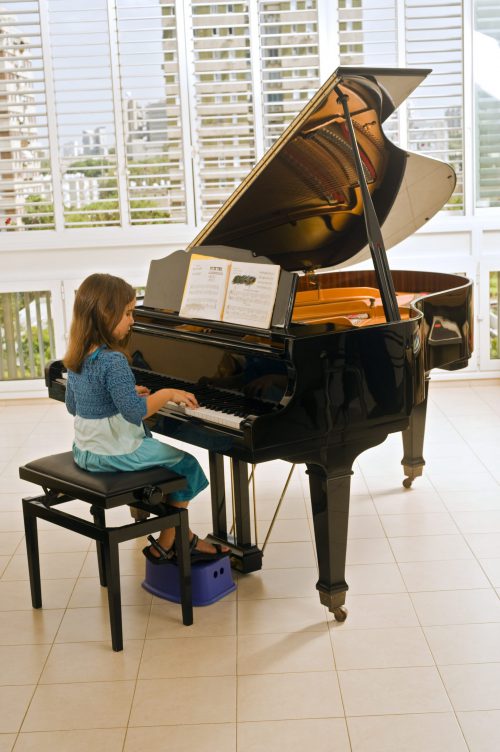 Little Girl Playing The Piano